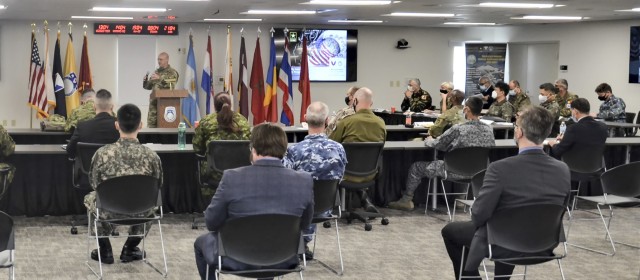 Brig. Gen. Douglas Lowrey, commander of Army Security Assistance Command,  speaks about the Security Assistance Liaison Office to a crowd consisting of fellow USASAC employees, Security Assistance Liaison Officers, and representatives from 8...
