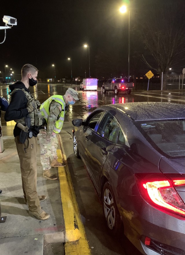 Specialist Jaxon Wright, 163rd Military Police Detachment, 716th Military Police Battalion, speaks with a driver March 17 at a sobriety checkpoint on Fort Campbell. Also pictured is Investigator Avery Neitzel, 163rd MP Co. According to the National Highway Traffic Safety Administration, 28 people in the U.S. die in drunk driving crashes each day. Fort Campbell hasn’t added onto that statistic in 2021, and the PMO’s sobriety checkpoints may be a factor.