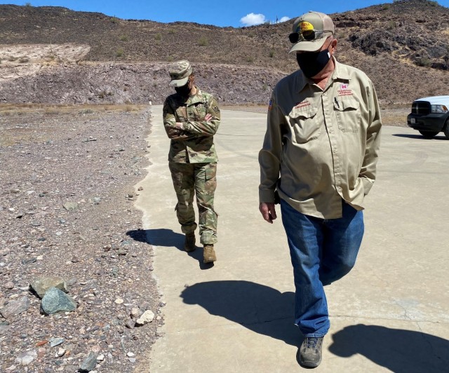 Donald “Donnie” May, dam operator, briefs Col. Julie Balten, U.S. Army Corps of Engineers Los Angeles District commander, during a tour of the Painted Rock Dam spillway March 24 near Gila Bend, Arizona. The spillway was built to keep flood waters from damaging the dam’s structure