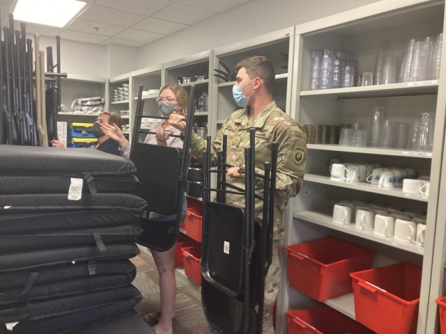 Private Second Class James Barber, 160th Special Operations Aviation Regiment, and his wife, Savannah McMahon, borrow a table, chairs and kitchen utensils March 16 from the Army Community Service-Relocation Readiness Program Lending Closet, 1501...