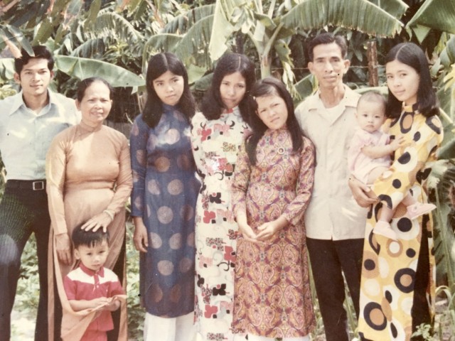 The family of U.S. Army Col. Danielle Ngo poses for a photo in the early 1970s, during the Vietnam War. Pictured are, from left; Ngo&#39;s uncle, Son, her grandmother, Ho Ngoc Vien, aunt Thai Anh, her mom Thai An, aunt Nhu-Y, and her grandfather, Ngo Ngoc Tung. Danielle Ngo is being held by her aunt, Tuong Van, on the far right. 