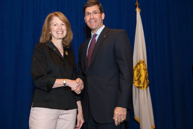 Diane Randon, now the assistant deputy chief of staff, G-2, poses for a photo with former Army Secretary Mark Esper after she received the Army Civilian Service Recognition pin during a ceremony Oct. 16, 2018.