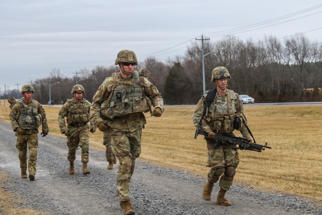 Soldiers from 1st Battalion, 327th Infantry Regiment “Above the Rest”, 1st Brigade Combat Team “Bastogne”, 101st Airborne Division (Air Assault) run to Range 11 Feb. 26 on Fort Campbell, Ky. during their culminating exercise during the Bulldog Machine Gun University. The Machine Gun University is a five-day course increasing lethality and proficiency of the battalion’s machine gun teams. According to the Feb. 26 101st Abn. Div. memorandum , individuals on Fort Campbell are exempt from wearing a mask while in engaging to moderate to to strenuous physical training activity. U.S. Army Photo by Maj. Vonnie Wright