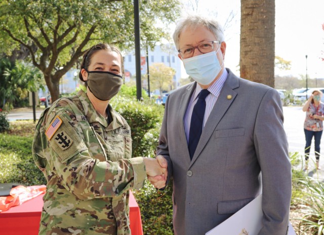 Lt. Col. Honderd, district engineer, and City of Charleston Mayor John Tecklenburg, pose in front of the Charleston District headquarters before a time capsule filling for the District's 150th anniversary.