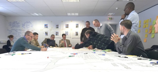 Personnel discuss possible future plans for sections of the camps area of the Grafenwoehr Training Area during collaboration sessions in spring 2019 that were part of creating an Area Development Execution Plan to outline the long-term plan for...