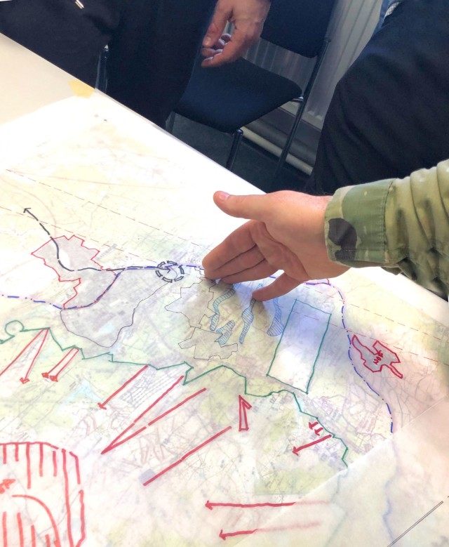 Soldiers and Civilian personnel discuss possible future plans for sections of the Grafenwoehr Training Area during collaboration sessions in spring 2019 that were part of creating an Area Development Execution Plan to outline the long-term plan...