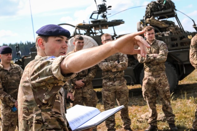 U.K. army 1st Lt. Hugo Chaplin, troop leader with 1st The Queen's Dragoon Guards, gives a safety brief to his soldiers before they start the first of a four day weapons training event with the Battle Group Poland at Bemowo Piskie Training Area, Poland, on May 15, 2018. Battle Group Poland is a unique, multinational coalition of U.S., U.K., Croatian and Romanian Soldiers who serve with the Polish 15th Mechanized Brigade as a deterrence force in support of NATO’s Enhanced Forward Presence. (U.S. Army photo by Spc. Hubert D. Delany III /22nd Mobile Public Affairs Detachment)