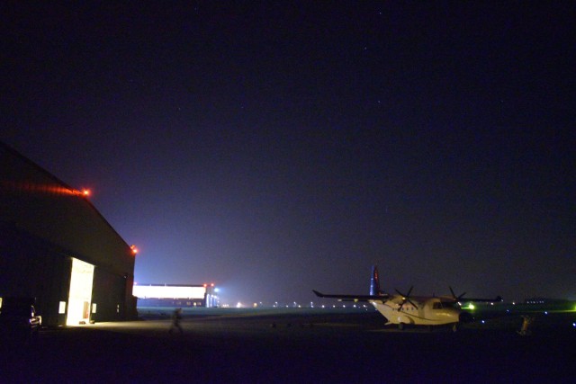 CHIÈVRES, Belgium – Members of the Belgian Special Forces Group runs to a CASA C-212, a medium cargo turboprop aircraft, to perform a night jump onto the airfield at Chièvres Air Base. For the first time, U.S. Army Garrison Benelux and 424th Air Base Squadron – an Air Force element at the garrison – hosted the Belgian Defense Forces’ Paratroopers Training Center as they held training and qualification jumps for their paracommandos March 1, 2021. (U.S. Army photo by Bryan Gatchell, USAG Benelux Public Affairs)