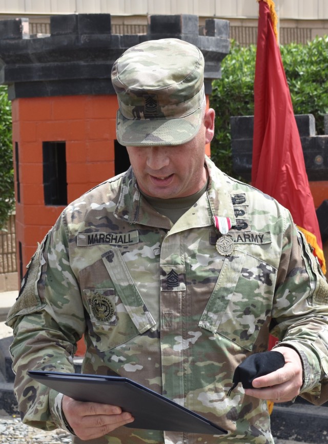 SGM Nathan Marshall removes his protective face mask to address the Team of Teams of the Transatlantic Afghanistan District. (Photo by Rick Benoit)