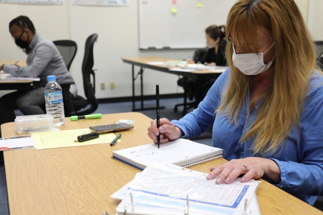 Kimberly Wade, a participant in Camp Zama’s “Head Start” class, practices writing her name in Japanese March 18 at the Camp Zama Education Center. The Head Start program went on hiatus in the spring of 2020 due to the COVID-19 pandemic,...