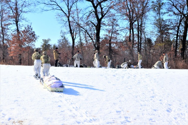 Students in Fort McCoy Cold-Weather Operations Course (CWOC) class 21-04, which mainly was comprised of Airmen, participate in cold-weather training scenario Feb. 26, 2021, on South Post at Fort McCoy, Wis. CWOC students are trained on a variety...