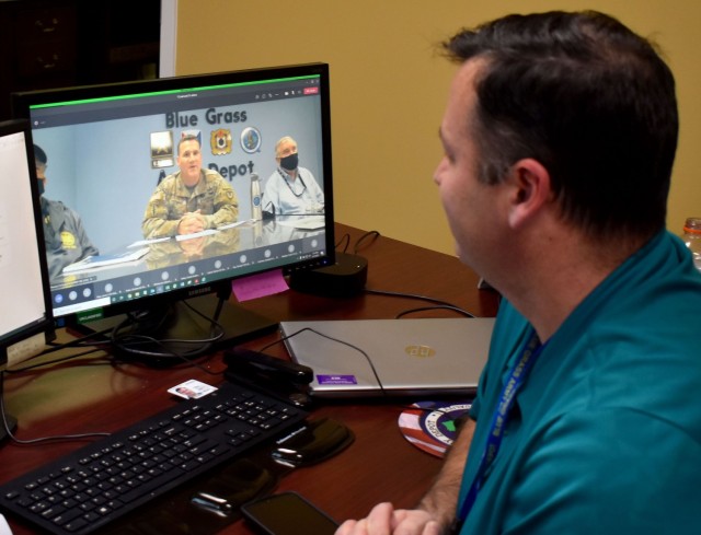 An employee at JMC’s subordinate installation, Blue Grass Army Depot, watches his command’s extremism training via the depot’s employee-only online forum to maintain COVID-19 mitigation measures.