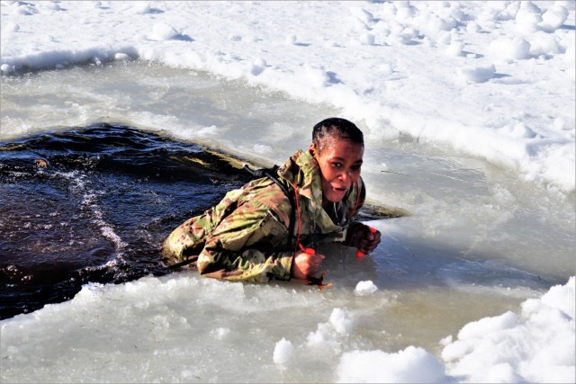 Airman 1st Class Jarva Brown with the 164th Security Forces Squadron at Memphis Air National Guard Base, Tenn., participates in cold-water immersion training Feb. 26, 2021, at Big Sandy Lake on South Post at Fort McCoy, Wis. CWOC students are...
