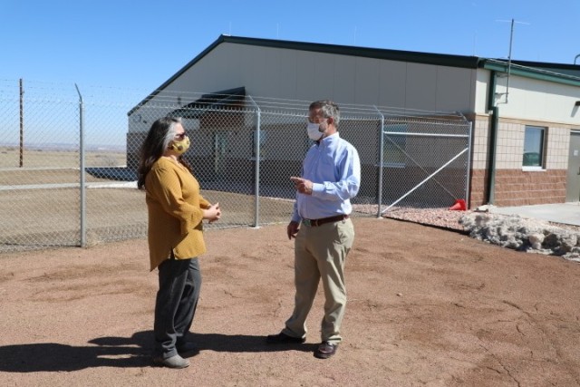 Greg Sipes (right) project engineer and contracting office representative, U.S. Army Corps of Engineers, Omaha District, Fort Carson South office, and Alice Gallegos, Army Supply Point supervisor, talk in front of the ammunition storehouse on Fort...