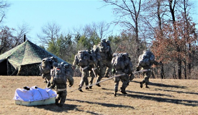 Students in Fort McCoy Cold-Weather Operations Course (CWOC) class 21-05 participate in a cold-weather training scenario March 19, 2021, on South Post at Fort McCoy, Wis. CWOC students are trained on a variety of cold-weather subjects, including...