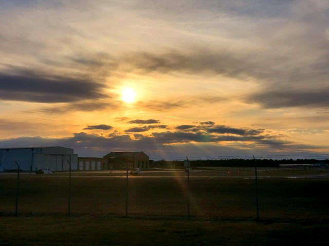 A scene of the setting sun is shown March 26, 2021, over the Sparta-Fort McCoy Airport, located on South Post at Fort McCoy, Wis. The airport is regularly used for training by military units, especially the Army and Air Force. Aircraft that have...
