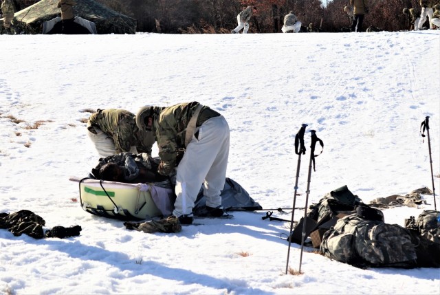 Students in Fort McCoy Cold-Weather Operations Course (CWOC) class 21-04, which mainly was comprised of Airmen, participate in cold-weather training scenario Feb. 26, 2021, on South Post at Fort McCoy, Wis. CWOC students are trained on a variety...