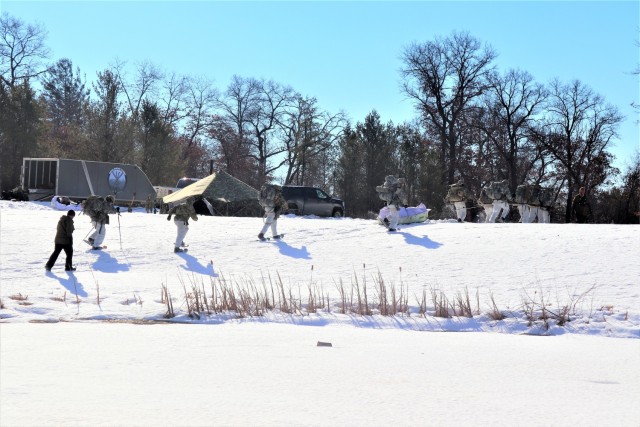 Students in Fort McCoy Cold-Weather Operations Course (CWOC) class 21-04, which mainly was comprised of Airmen, participate in cold-weather training scenario Feb. 26, 2021, on South Post at Fort McCoy, Wis. CWOC students are trained on a variety...