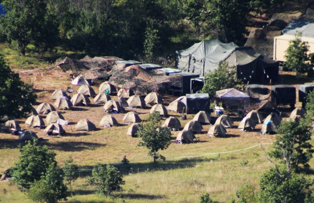 Service members hold training Aug. 4, 2020, at a training area on South Post at Fort McCoy, Wis. Training like this contributed to Fort McCoy’s $1.479 billion local economic impact during fiscal year 2020. Thousands of people train at the...