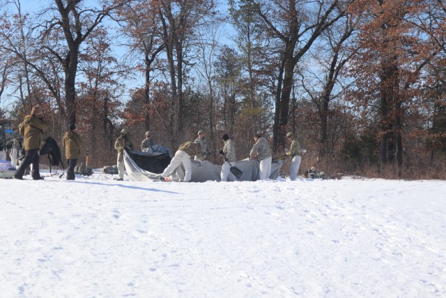 Students in Fort McCoy Cold-Weather Operations Course (CWOC) class 21-04, which mainly was comprised of Airmen, participate in cold-weather training scenario Feb. 26, 2021, on South Post at Fort McCoy, Wis. CWOC students are trained on a variety...