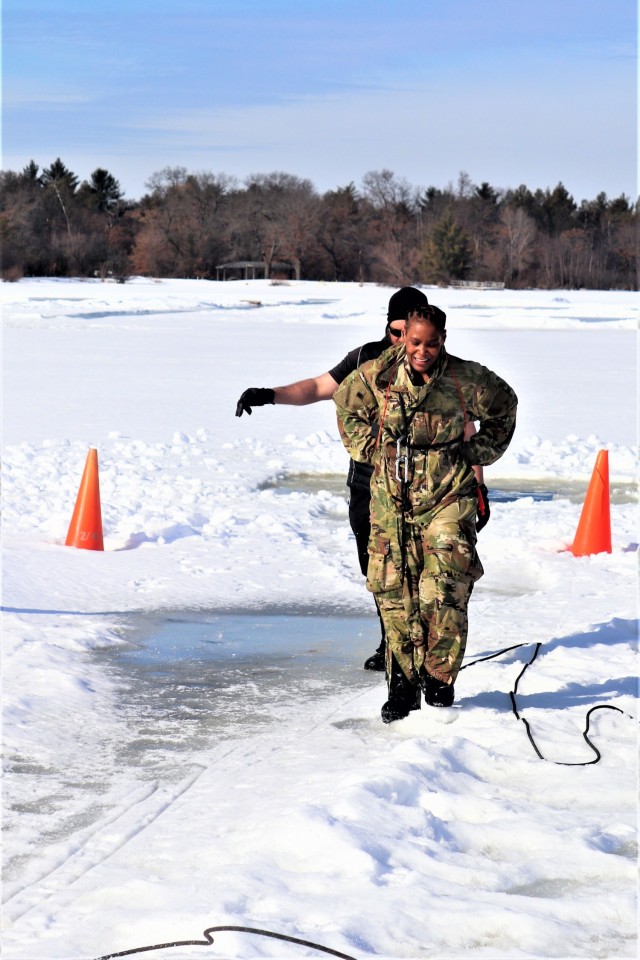 Airman 1st Class Jarva Brown with the 164th Security Forces Squadron at Memphis Air National Guard Base, Tenn., participates in cold-water immersion training Feb. 26, 2021, at Big Sandy Lake on South Post at Fort McCoy, Wis. CWOC students are...