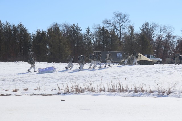 Students in Fort McCoy Cold-Weather Operations Course (CWOC) class 21-04, which mainly was comprised of Airmen, participate in cold-weather training scenario Feb. 26, 2021, on South Post at Fort McCoy, Wis. CWOC students are trained on a variety...