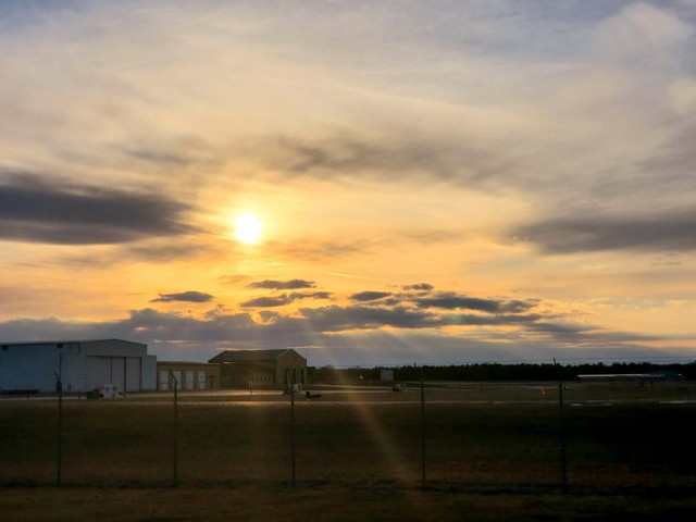 A scene of the setting sun is shown March 26, 2021, over the Sparta-Fort McCoy Airport, located on South Post at Fort McCoy, Wis. The airport is regularly used for training by military units, especially the Army and Air Force. Aircraft that have...