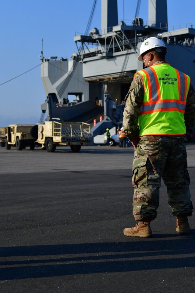 An 841st Transportation Battalion Soldier monitors the load of the USNS Bob Hope at the Port of Jacksonville March 21 in support of DEFENDER-Europe 21. DEFENDER-Europe is an annual large-scale U.S. Army-led, multinational, joint exercise designed to build readiness and interoperability between U.S., NATO and partner militaries. This year’s exercise utilizes key ground and maritime routes bridging Europe, Asia and Africa.