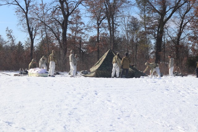 Students in Fort McCoy Cold-Weather Operations Course (CWOC) class 21-04, which mainly was comprised of Airmen, participate in cold-weather training scenario Feb. 26, 2021, on South Post at Fort McCoy, Wis. CWOC students are trained on a variety...