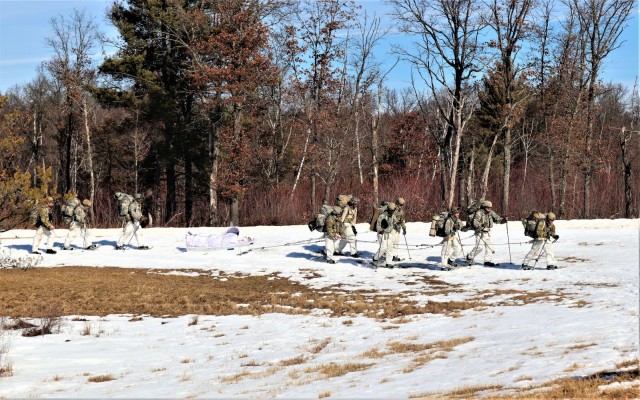 Students in Fort McCoy Cold-Weather Operations Course (CWOC) class 21-04, which mainly was comprised of Airmen, participate in cold-weather training scenario Feb. 26, 2021, on South Post at Fort McCoy, Wis. CWOC students are trained on a variety...