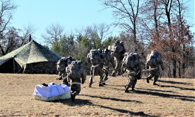 Students in Fort McCoy Cold-Weather Operations Course (CWOC) class 21-05 participate in a cold-weather training scenario March 19, 2021, on South Post at Fort McCoy, Wis. CWOC students are trained on a variety of cold-weather subjects, including...