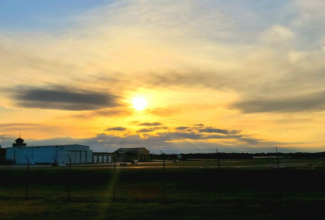 A scene of the setting sun is shown March 26, 2021, over the Sparta-Fort McCoy Airport, located on South Post at Fort McCoy, Wis. The airport is regularly used for training by military units, especially the Army and Air Force. Aircraft that have...