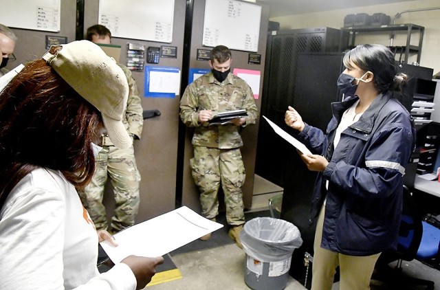 Amanda Pete, (right) physical security supervisor with the Directorate of Emergency Services Physical Security Division, walks new armorers through an arms room inspection checklist during a recent training session.

