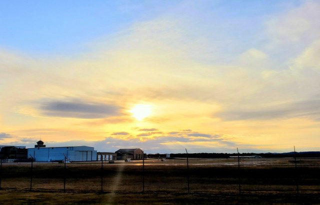 A scene of the setting sun is shown March 26, 2021, over the Sparta-Fort McCoy Airport, located on South Post at Fort McCoy, Wis. The airport is regularly used for training by military units, especially the Army and Air Force. Aircraft that have...