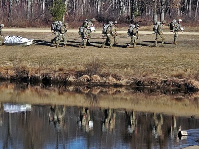 Students in Fort McCoy Cold-Weather Operations Course (CWOC) class 21-05 participate in a cold-weather training scenario March 19, 2021, on South Post at Fort McCoy, Wis. CWOC students are trained on a variety of cold-weather subjects, including...