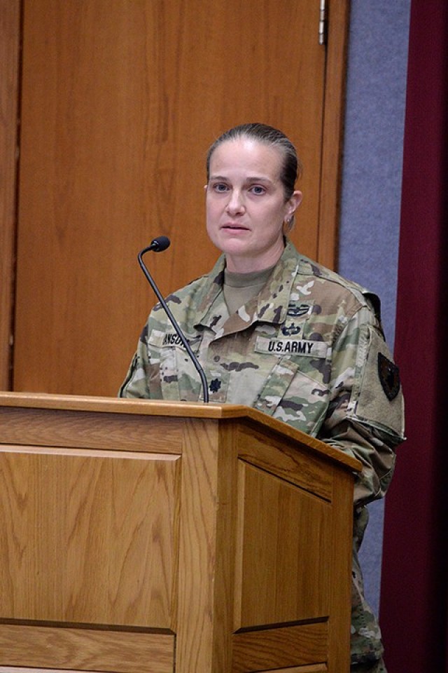 Guest speaker Lt. Col. Corrie Hanson, 705th Military Police Battalion (Detention) commander, speaks to the small in-person audience and the larger online audience watching on Facebook during the Women’s History Month observance March 26 in Grant Auditorium. Photo by Prudence Siebert/Fort Leavenworth Lamp