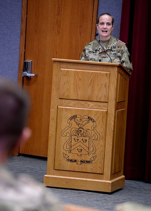 Guest speaker Lt. Col. Corrie Hanson, 705th Military Police Battalion (Detention) commander, speaks to the small in-person audience and the larger online audience watching on Facebook during the Women’s History Month observance March 26 in Grant Auditorium. Photo by Prudence Siebert/Fort Leavenworth Lamp