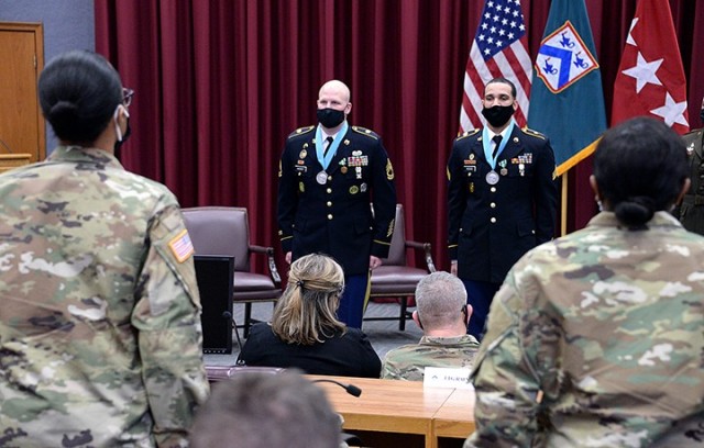 Newly inducted Sergeant Audie Murphy Club members Sgt. 1st Class Chad Hickey, 291st Military Police Company, 40th MP Battalion (Detention), and Sgt. Anthony Hogan, 256th MP Company, 40th, recite the NCO Creed with other NCOs in attendance during...