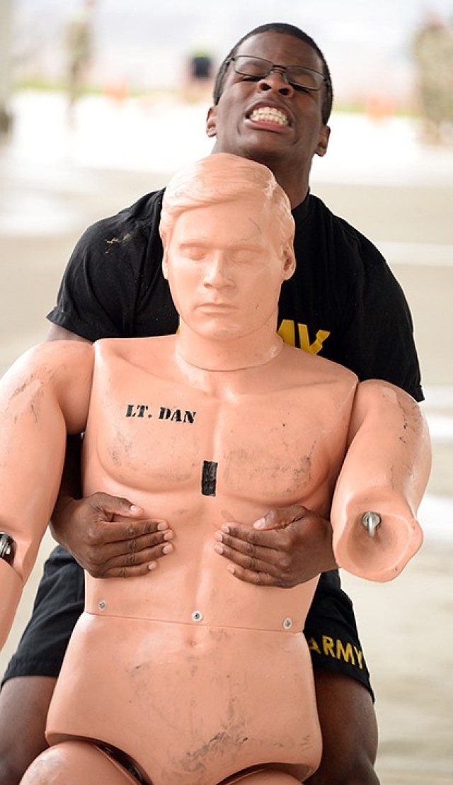 Pfc. Elijah Nash, 526th Military Police Company, 40th MP Battalion (Detention), drags a dummy 100 meters in the Iron Griffin gauntlet course, which also included 100-meter iterations of a water jug carry, bear crawl and sprint, during the 15th MP...