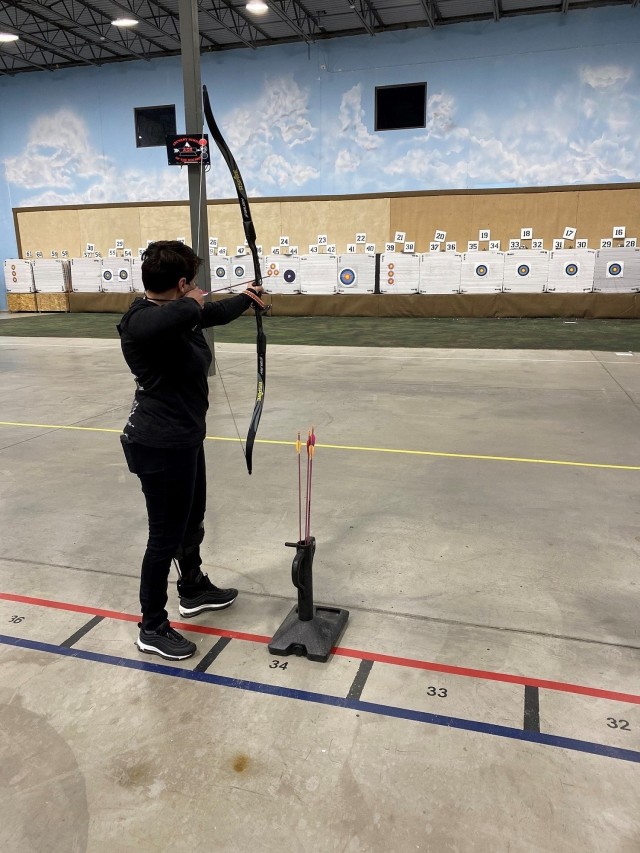 Maj. Adriana de Julio took aim at a target at the Archery School of the Rockies on March 11, 2021. She competed in archery, air rifle and cycling events in the 2021 Army Trials. (Photo courtesy of Courtney Medeiros)