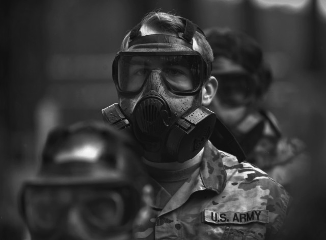 Soldiers of the 217th Military Police Detachment wait to enter the gas chamber during training conducted April 1 at the Fort Lee range complex. Demonstrating the ability to quickly and correctly use chemical, biological, radiological and nuclear protective gear is part of the unit’s annual training requirements.