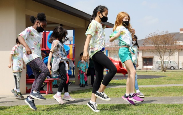 From left, AnneGrace Meachem, Jazlynn Senders, Leila Kaea, Natalie Dalton and Andrea Crispell, all third-graders, perform the “Jerusalema Dance” during the opening ceremony of the 2021 School Age Center Olympics at Sagamihara Family Housing...