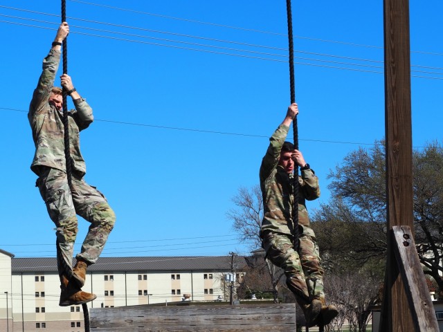 1st Lt. Brian Billings from 2nd Squadron and 1st Lt. Nick Layden from 4th Squadron, 3rd Cavalry Regiment, have ramped up training for the Best Ranger Competition. One day, they completed a nine-mile run, followed by an eight-mile ruck, and closed out the training with a 20-minute obstacle course workout. The competition runs from April 11-16 at Fort Benning, Georgia. (U.S. Army photo by Pfc. Johnathan Touhey)