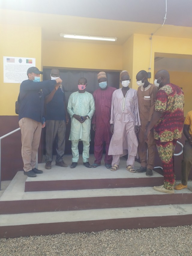 Humanitarian Assistance Program Coordinator Cosme Quenum, a local national with the U.S. Embassy in Cotonou, Benin, turns over the keys of a newly constructed health clinic to local officials in the village of Godjekoara, Benin in Africa at the...