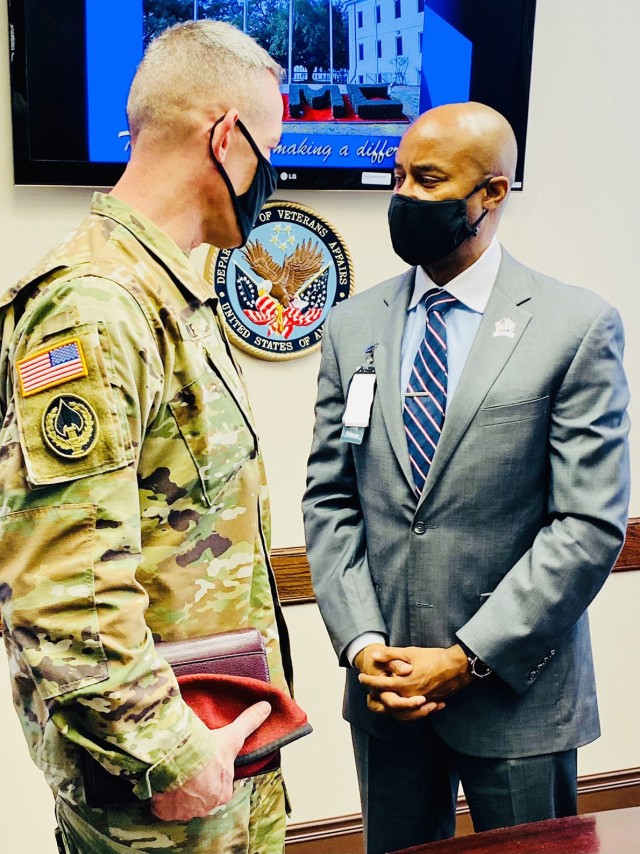 Brig. Gen. David Doyle, Joint Readiness Training Center and Fort Polk commanding general, talks to Peter C. Dancy Jr., director, Alexandria Veterans Administration Medical Center during a community outreach visit.