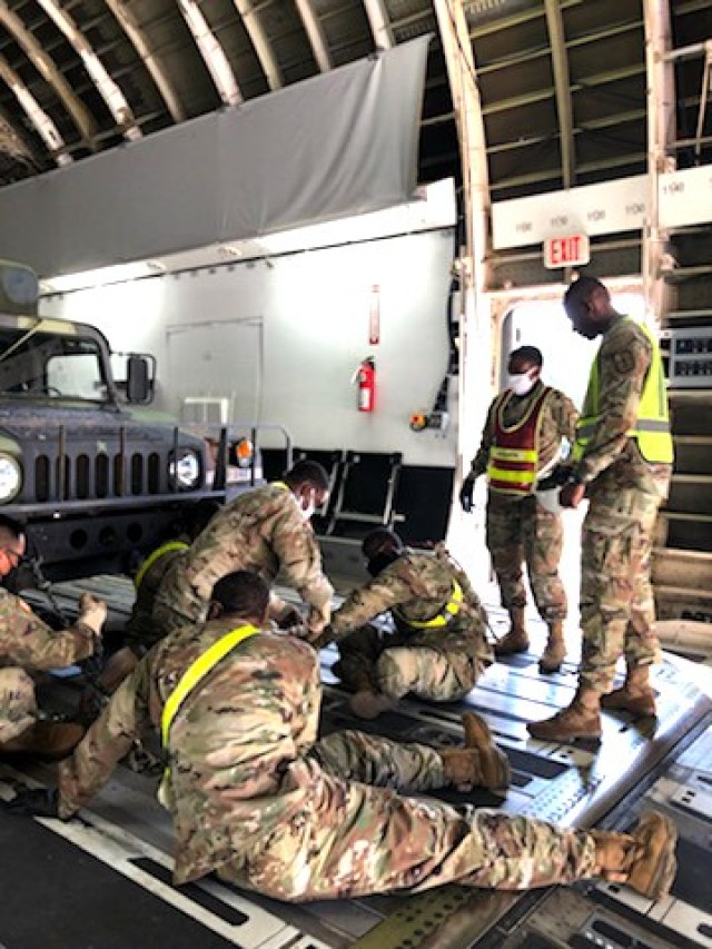 Command Sgt. Maj. Terrence T. Scarborough, Trans. Corps CSM (standing to the right), observes advanced individual training Soldiers while they tackle military occupational specialty tasks during a recent training session at Fort Lee.