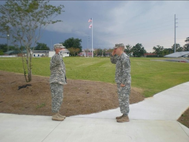 In 2017 Staff Sgt. John ‘Jordan’ Travis, domestic operations management support, emergency operations center, NCOIC, rendered the last salute to his father, Col. William ‘Terry’ Travis, before his retirement.  (Courtesy photo from family.)