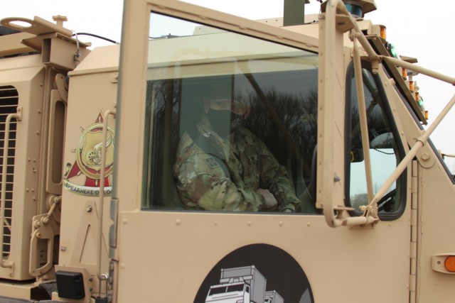 Maj. Gen. Darren Werner, Commanding General U.S. Army Tank-automotive and Armaments Command, prepares for a ride along in the Follower vehicle at a Leader – Follower demonstration on the Detroit Arsenal, Mich. Apr. 5.  The Follower vehicle is controlled by a robotic kit that will self-drive to keep speed and pace with the Leader vehicle.