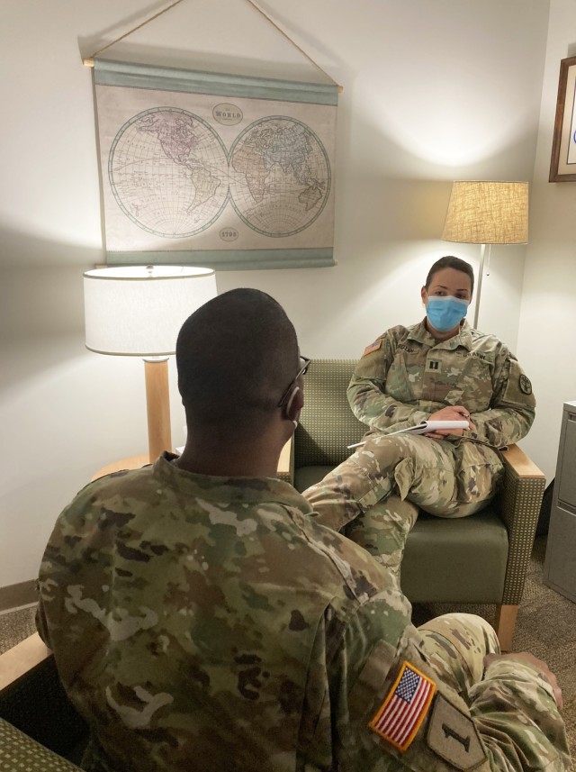 Captain Ioana Horotan, staff psychiatrist at Blanchfield Army Community, speaks with a Soldier about alcohol awareness. There are many resources available to Soldiers and Family members concerned about potential addiction or overusing alcohol.