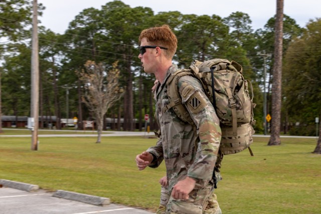 U.S. Army 1st Lt. Zachary Hobson, a mortar platoon leader assigned to 1st Armored Brigade Combat Team, 3rd Infantry Division, finishes a 24-mile ruck march with his training partner, April 9, 2021, on Fort Stewart, Georgia. Hobson and his training partner are currently deployed in South Korea and have returned to the United States to participate in the 2021 Best Ranger Competition slated to take place at Fort Benning, Georgia, April 16-18. (U.S. Army photo by Pfc. Summer Keiser)